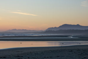 Tofino, sea and beach in evening mood, mountains in the background, Canada Tofino, sea and beach in evening mood, mountains in the background, Canada